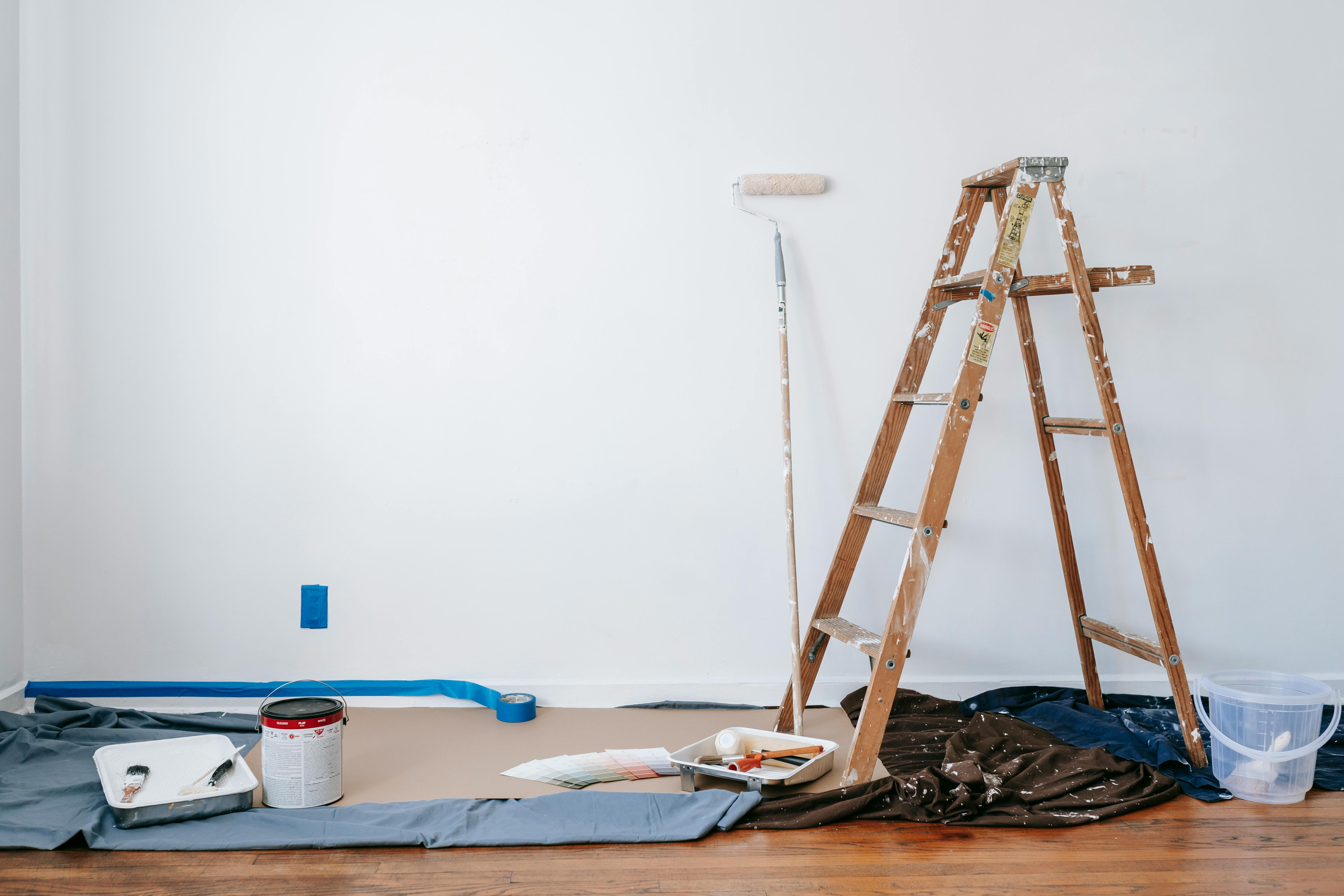 A ladder and other tools for making repairs to a home